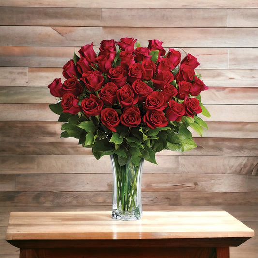 Thirty-six roses in a glass vase